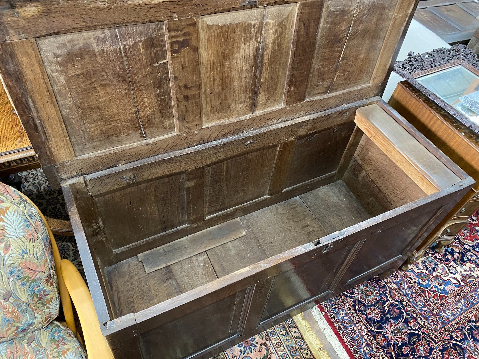 An early 18th century panelled oak coffer, length 136cm, depth 56cm, height 73cm